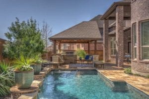 A beautiful pool showing off plants and scuppers.