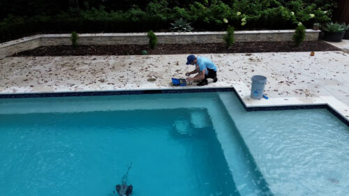 pool maintenance in backyard
